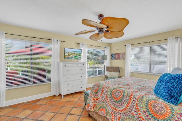 bedroom with light tile patterned floors and ceiling fan