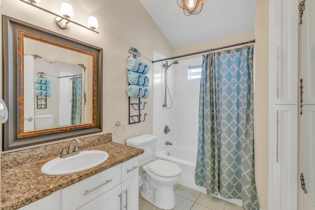 full bathroom featuring vaulted ceiling, vanity, toilet, shower / bath combo, and tile patterned floors