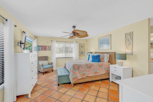 bedroom with light tile patterned floors and ceiling fan