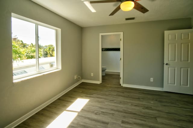 unfurnished bedroom featuring hardwood / wood-style floors and ceiling fan