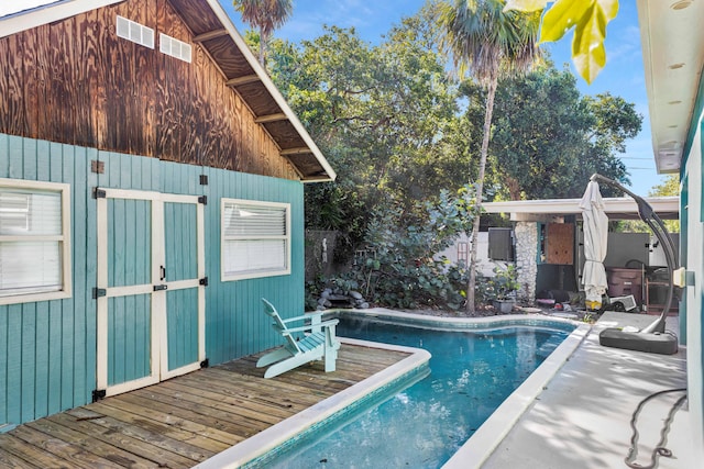 outdoor pool with a deck