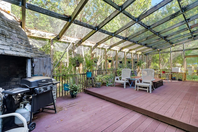 wooden terrace with a grill