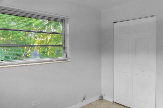 interior space featuring baseboards