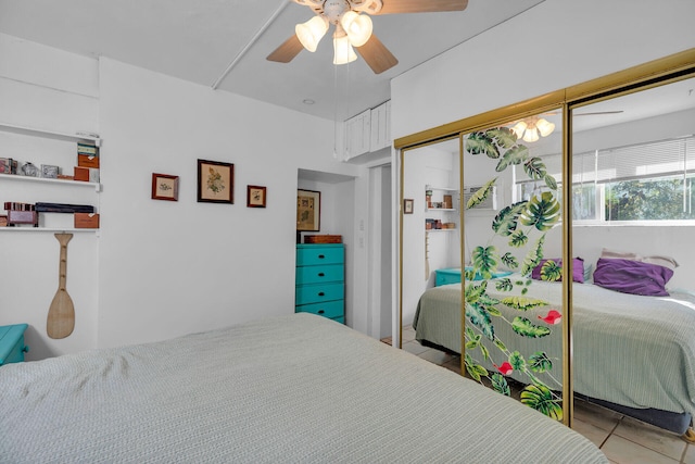 bedroom featuring ceiling fan and a closet