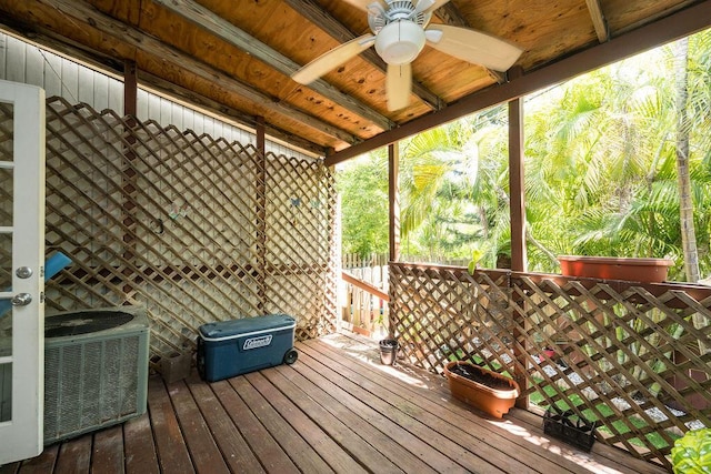 wooden terrace with cooling unit and a ceiling fan