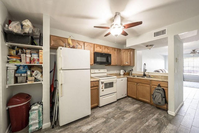 kitchen with ceiling fan, white appliances, a sink, visible vents, and light countertops