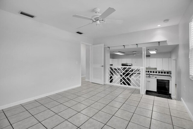 unfurnished living room with ceiling fan and light tile patterned floors