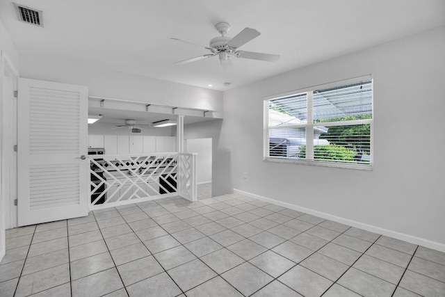 unfurnished room featuring ceiling fan