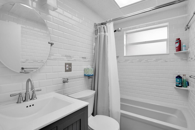 full bathroom featuring shower / tub combo with curtain, tasteful backsplash, tile walls, vanity, and toilet