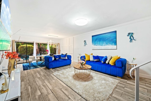 living area featuring ornamental molding, wood finish floors, and baseboards