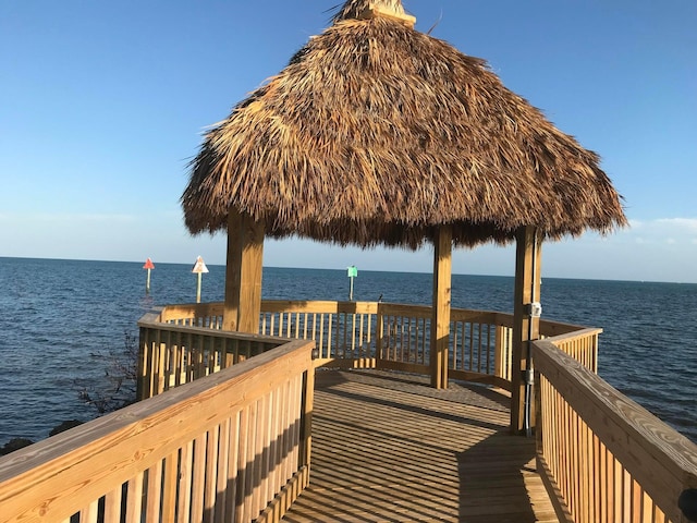 dock area with a water view and a gazebo