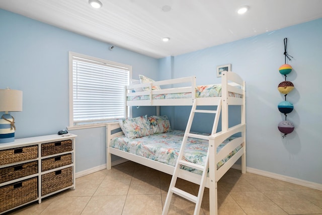 tiled bedroom featuring recessed lighting and baseboards