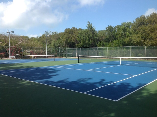 view of sport court with fence