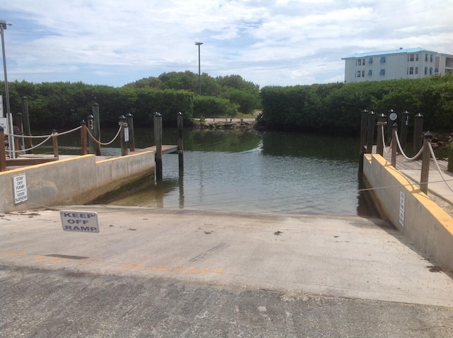 dock area featuring a water view