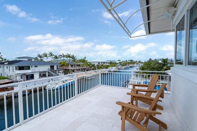 balcony featuring a water view