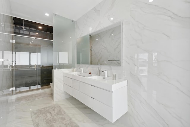 bathroom with vanity, tile walls, an enclosed shower, and toilet