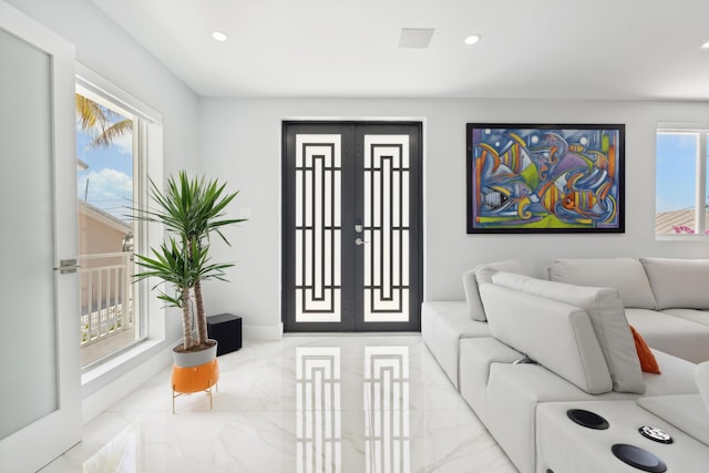 living room with french doors and plenty of natural light