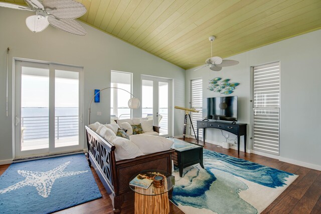 living room with french doors, ceiling fan, dark wood-type flooring, and vaulted ceiling