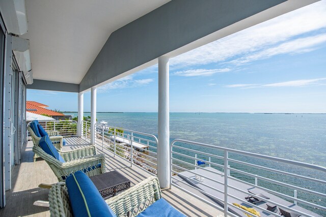 balcony featuring a water view