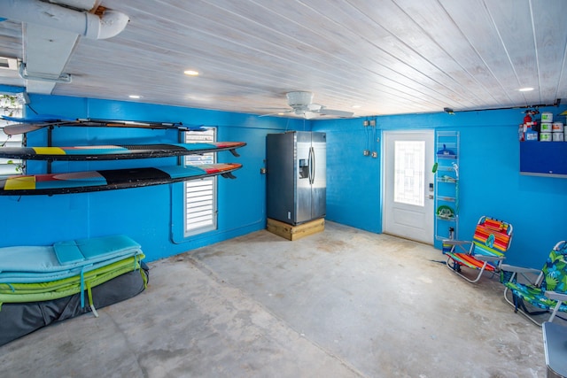 garage with stainless steel fridge with ice dispenser