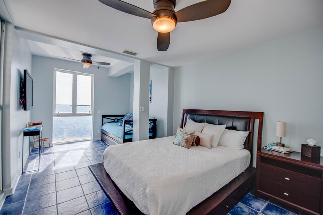 tiled bedroom featuring access to exterior and ceiling fan