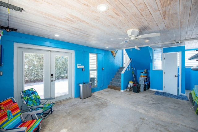 garage with wooden ceiling, french doors, and ceiling fan