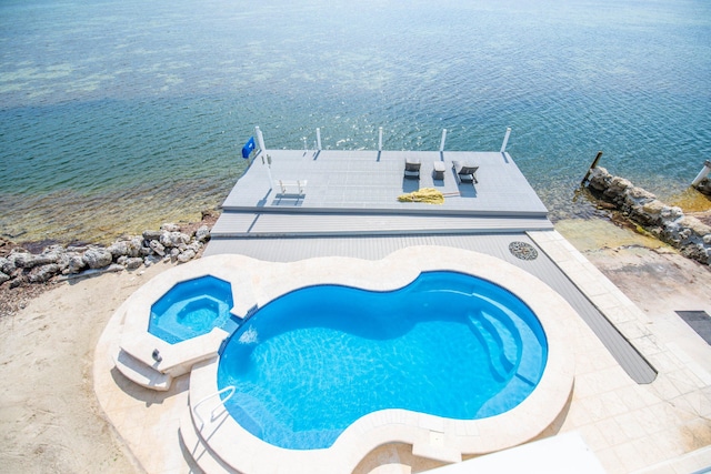 view of pool featuring a water view