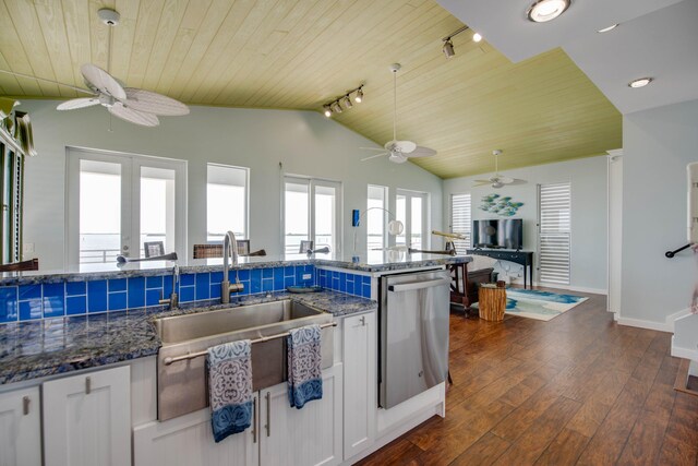 kitchen with white cabinetry, dark hardwood / wood-style flooring, decorative light fixtures, and dishwasher