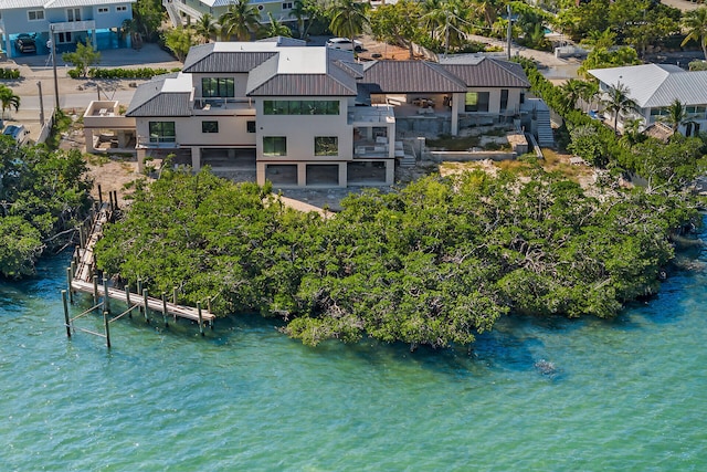 birds eye view of property featuring a water view and a residential view