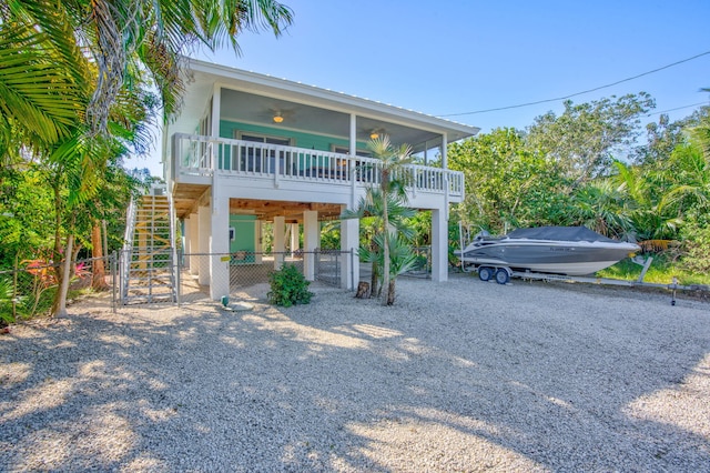 coastal home with ceiling fan