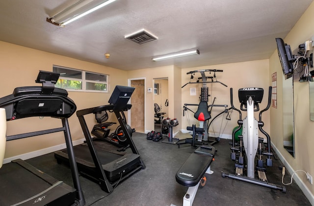 exercise area with a textured ceiling