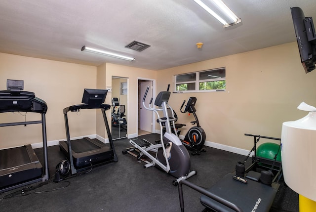 workout area with a textured ceiling