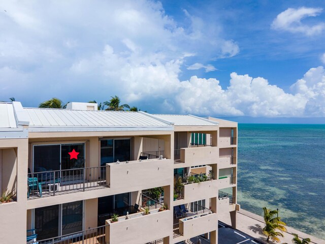 view of building exterior with a water view