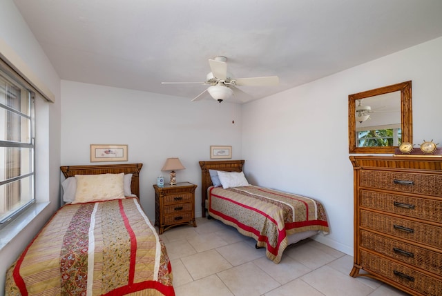 tiled bedroom featuring ceiling fan