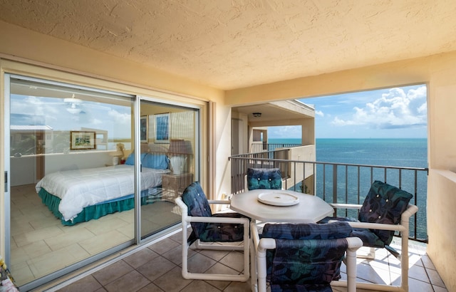 balcony featuring a water view