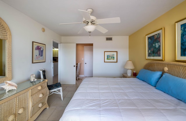 bedroom featuring light tile patterned floors and ceiling fan