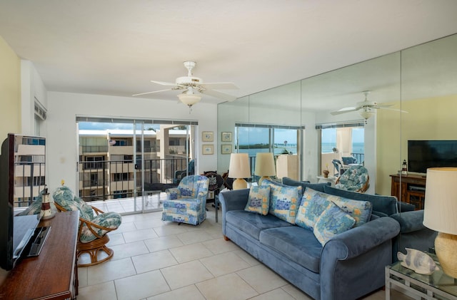 tiled living room with ceiling fan