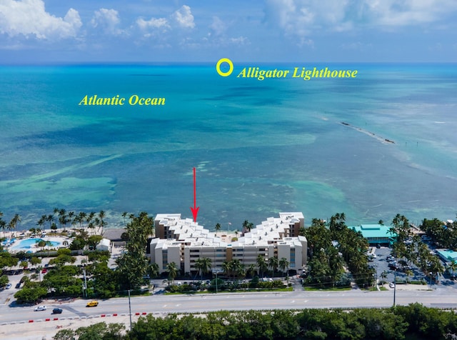 birds eye view of property featuring a water view