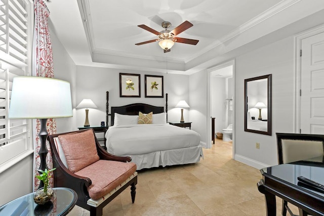 3841 N Roosevelt Blvd Unit 315, Key West, FL 33040 - bedroom featuring baseboards, crown molding, connected bathroom, a ceiling fan, and a tray ceiling