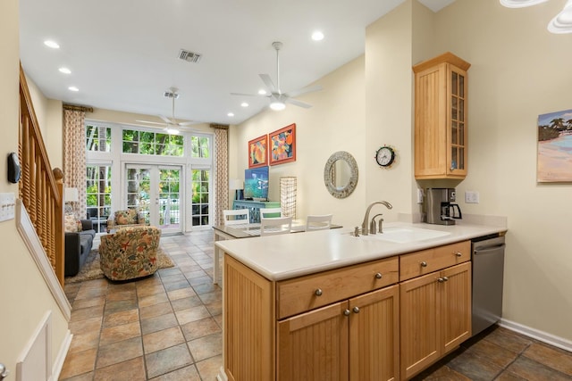 kitchen featuring french doors, sink, stainless steel dishwasher, kitchen peninsula, and ceiling fan