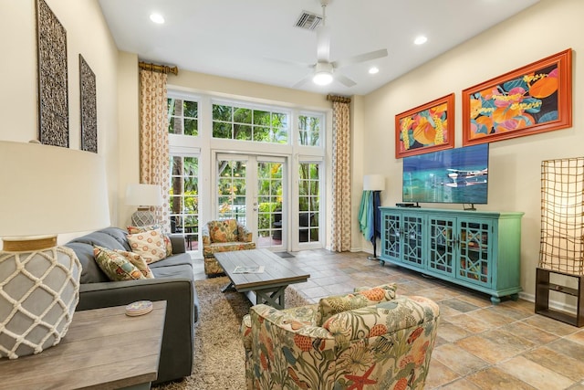 living room featuring ceiling fan and french doors