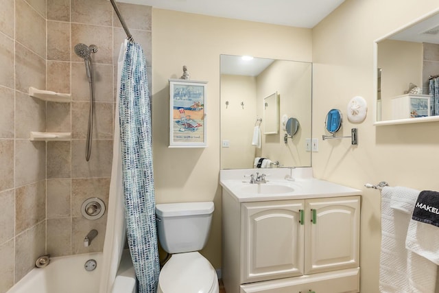 full bathroom with shower / bath combo, vanity, and toilet