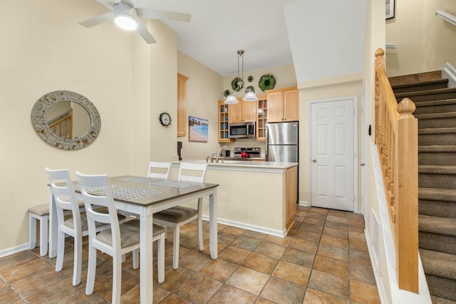 dining room featuring sink and ceiling fan