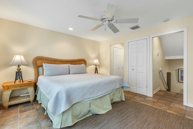 bedroom featuring two closets and ceiling fan