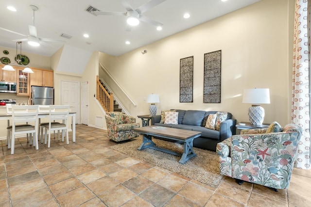 living room with lofted ceiling and ceiling fan