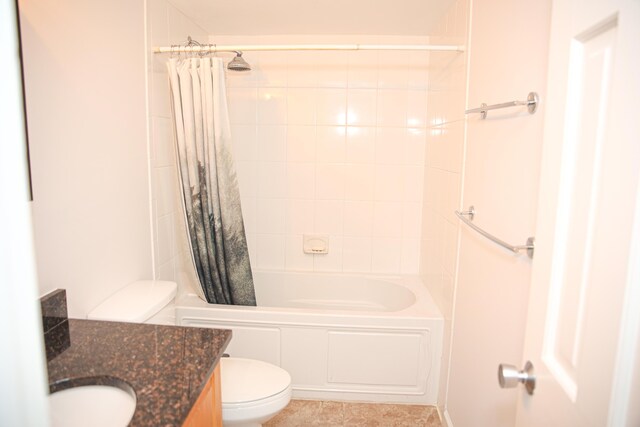 full bathroom featuring vanity, shower / bath combination with curtain, and toilet