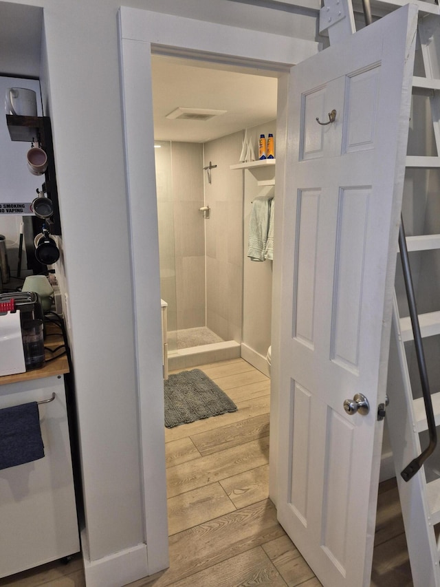 1220 Newton St Unit 1, Key West, FL 33040 - bathroom featuring tiled shower and wood finished floors