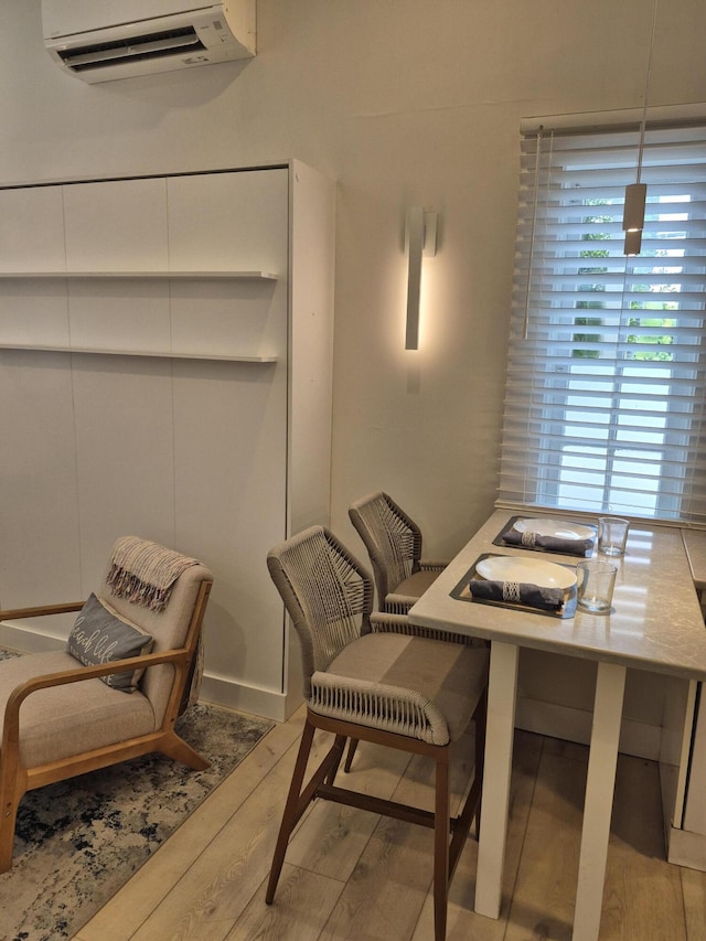 1220 Newton St Unit 1, Key West, FL 33040 - dining area featuring wood finished floors and an AC wall unit