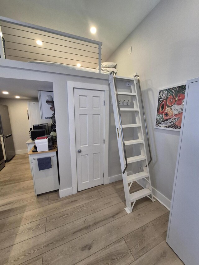 1220 Newton St Unit 1, Key West, FL 33040 - staircase featuring wood finished floors and recessed lighting