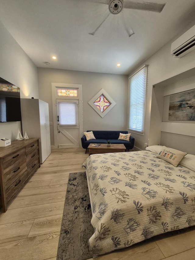 1220 Newton St Unit 1, Key West, FL 33040 - bedroom with a wall mounted air conditioner, a ceiling fan, light wood-style flooring, and recessed lighting